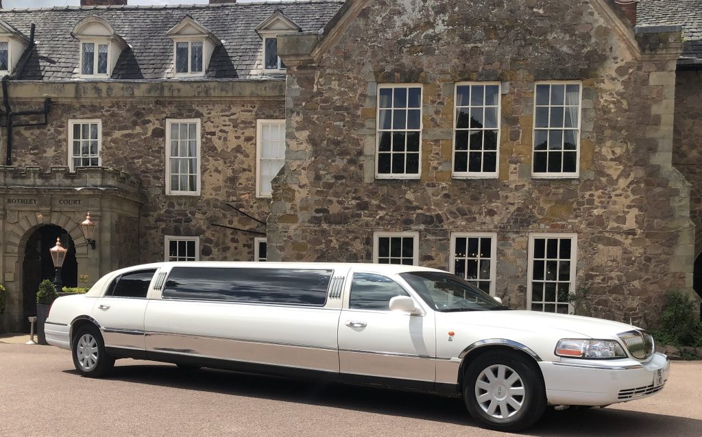 Leicester Wedding Lincoln Town car beside park