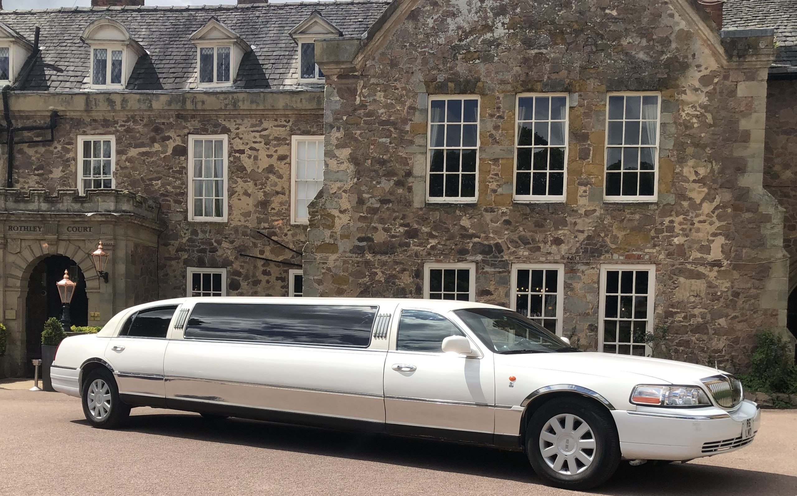 Leicester Wedding Lincoln Town car beside park